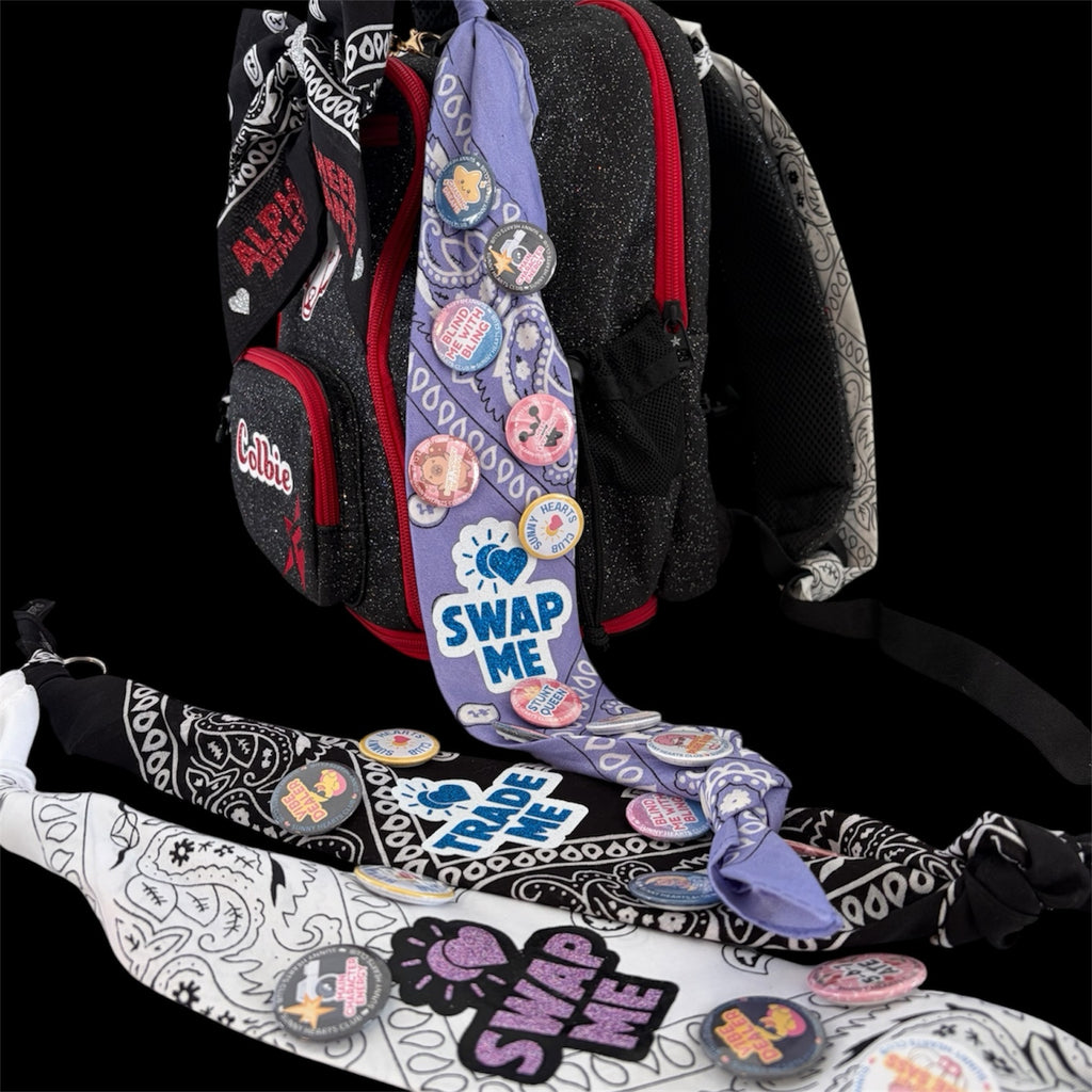 Sunny Hearts Club backpack accessory set featuring black, white, and lilac bandana ribbons decorated with cheer pins.